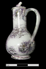 Image of tall slender jug with splashed/mottled luster.